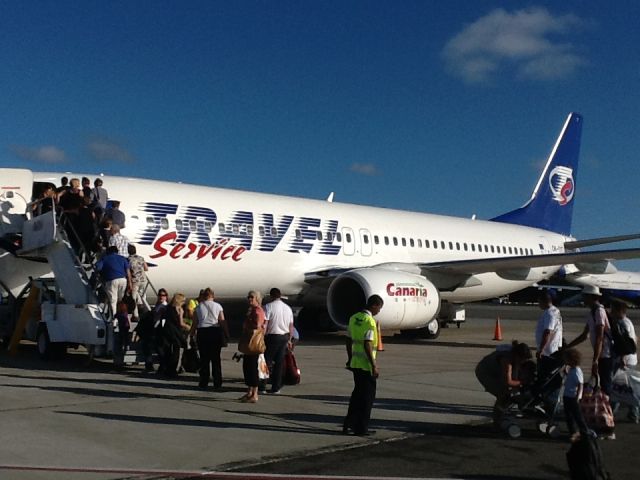 Boeing 737-700 (OK-TVT) - Boarding Sunwing flt #425 at Punta Cana headed to YUL on 19/12/2012 away from the crowded gates! The plane is a lease (not sure if wet or dry) from Czech's Travel Service.