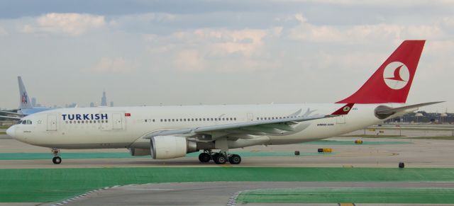 Airbus A330-200 (TC-JND) - Taxiing past Terminal 3 at KORD after arriving from Istanbul.  This location at an American Airlines gate was perfect for snapping photos.  