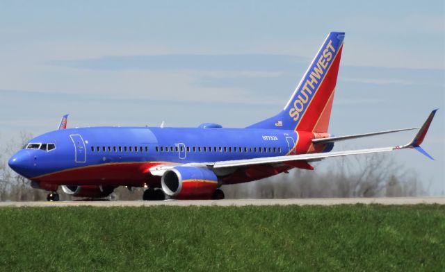 Boeing 737-700 (N7732A) - Interesting paint job on the front half... 737-700 on the takeoff roll