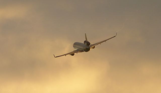 Boeing MD-11 — - A Lufthansa Cargo (unknown reg) taking off from FRA's center runway in the evening.