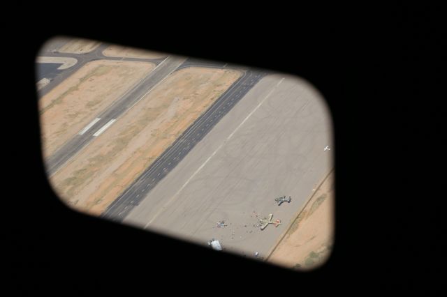 Consolidated B-24 Liberator (N224J) - Collings Foundation "Wings of Freedom Tour," 9 Apr 16, at Marana Regional Airport, AZ.  B-24J, Witchcraft, NX224J.  Looking down at KAVQ with B-25J, Tondelayo, NL3476G; P-51B, Betty Jane, N251MX; and B-17G, Nine-O-Nine, N93012, on the ground.