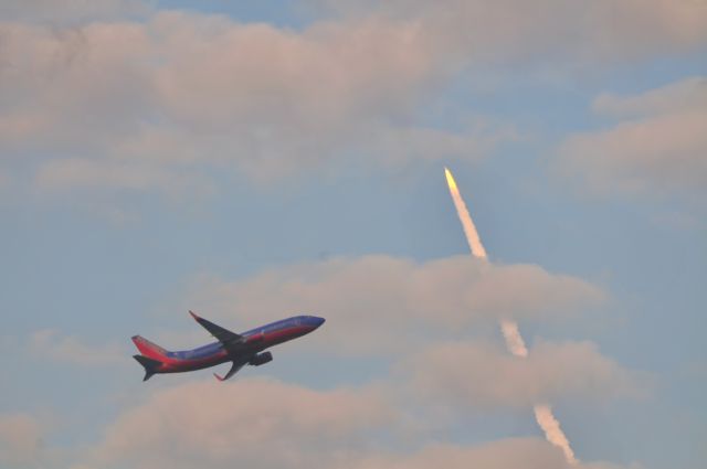 — — - STS-133, 24 Feb 11 with unknown Southwest flight in foreground, from six miles south of MCO, Orlando.