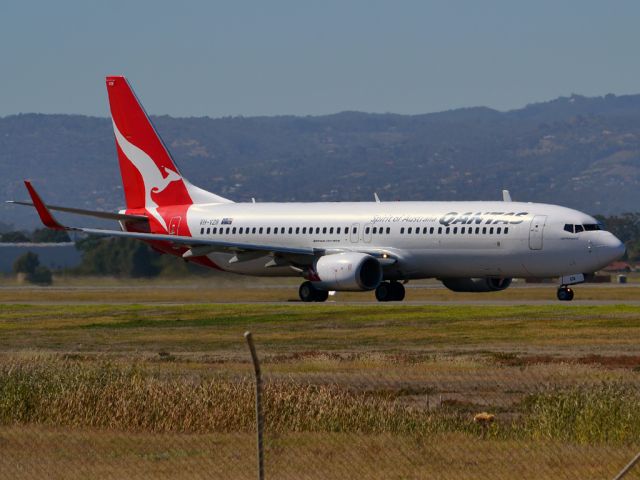 Boeing 737-800 (VH-VZB) - On taxi-way heading for take off on runway 05. Thursday 12th April 2012.