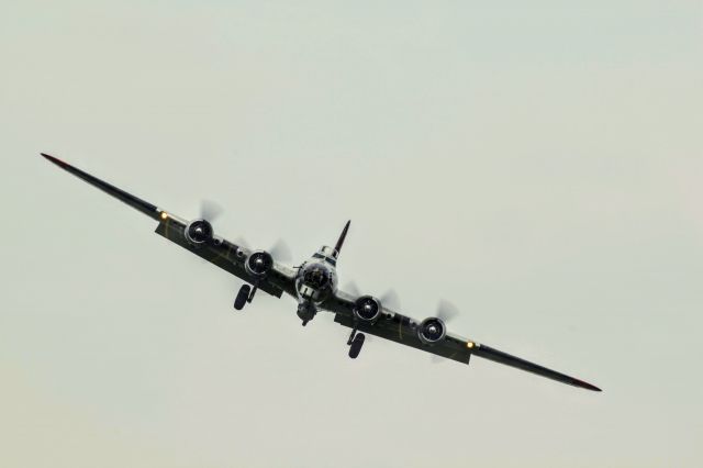 Boeing B-17 Flying Fortress (N5017N) - B-17G Flying Fortress “Aluminum Overcast” landing at the field behind the National Museum of the United States Air Force for the Memphis Belle unveiling. 