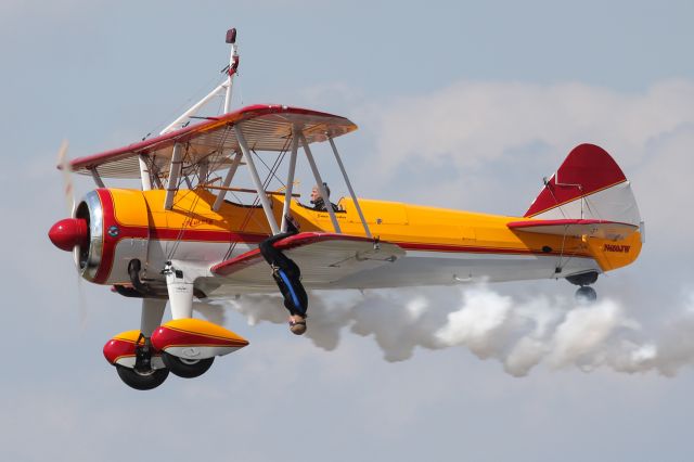 Boeing PT-17 Kaydet (N450JW) - Jane Wicker hanging down from the wing of 'Aurora', by far the best act at the Sun 'n Fun airshow !