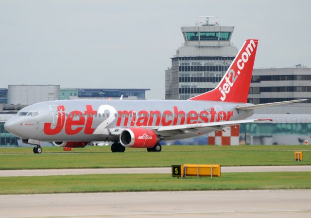 de Havilland Dash 8-400 (G-CELI) - Hello from EGCC MANchester, England.    Jet 2 B73.3 taxies along RW23R, with the tower in the background, and displaying its rather original colour scheme.