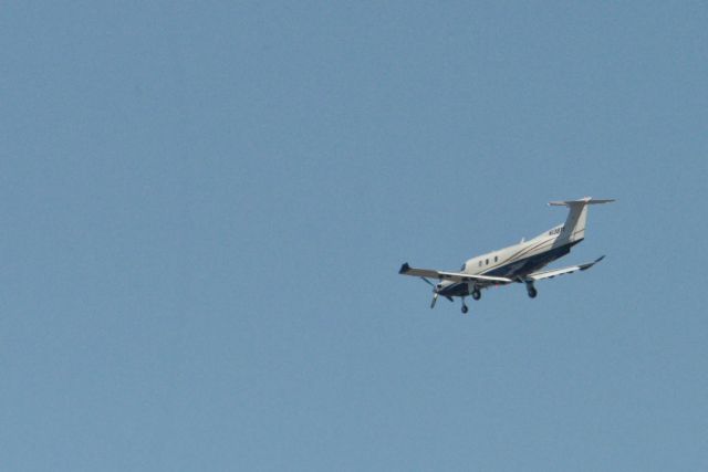 Pilatus PC-12 (N138TV) - A 2011 Pilatus Ltd. PC-12/47E approaches Davidson Air Field at Fort Belvoir, Va., from over Pohick Bay.  20 March 2014