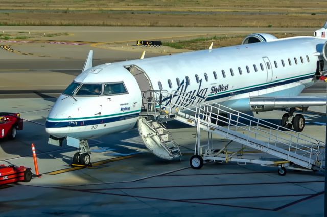 Canadair Regional Jet CRJ-700 (N217AG) - The last CRJ700 in the Alaska fleet seen here in Santa Barbara in 2013 getting ready for its flight to Portland that morning.