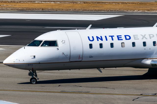 Canadair Regional Jet CRJ-200 (N979SW) - Taxiing of the runaway arrives the Denver flight looking a bit battle worn 