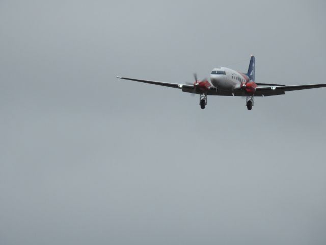 — — - DC-3 conversion landing at CYQA