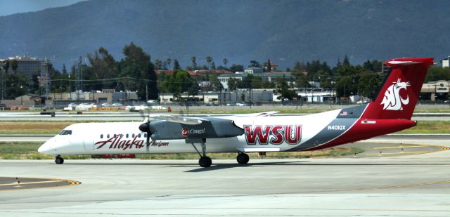 de Havilland Dash 8-300 (N401QX) - Taxiing to gate  06-30-2013