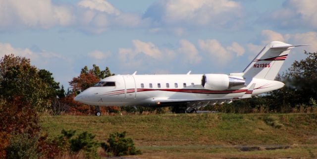 Canadair Challenger (N213GS) - Shown departing on the active runway is this 2014 Canadair Bombardier Challenger 605 in the Autumn of 2021.