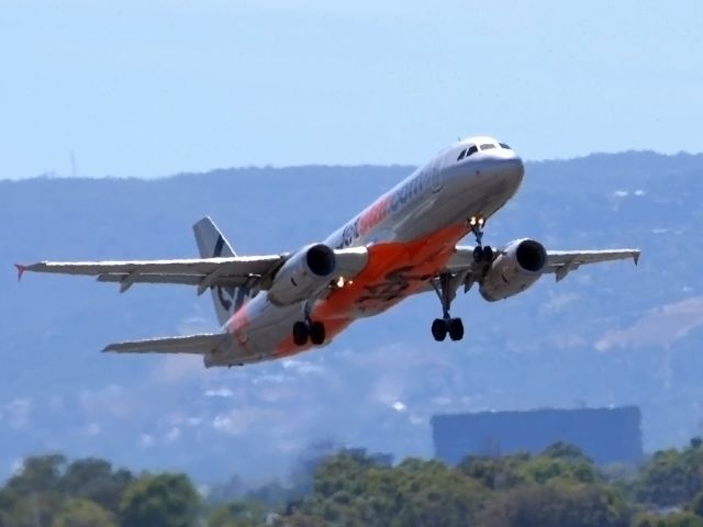 Airbus A320 (VH-VQE) - Getting airborne off runway 23. Wednesday 4th January 2012.