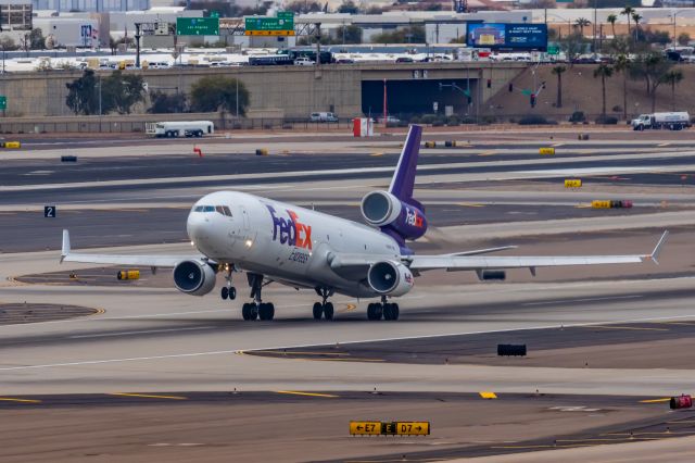 Boeing MD-11 (N606FE) - A FedEx MD11 taking off from PHX on 2/14/23. Taken with a Canon R7 and Canon EF 100-400 II L lens.