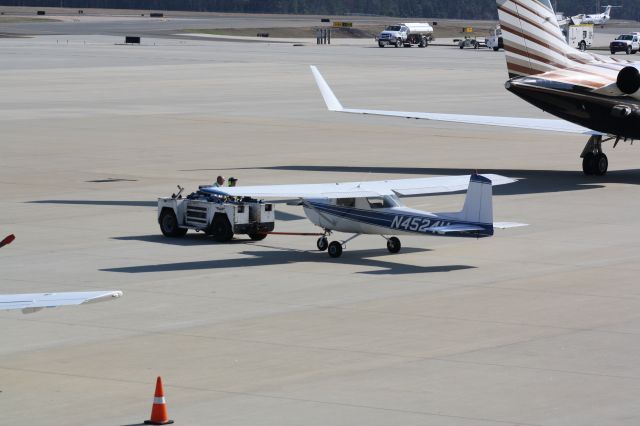 Cessna Commuter (N4524U) - N4524U being towed across the Landmark ramp