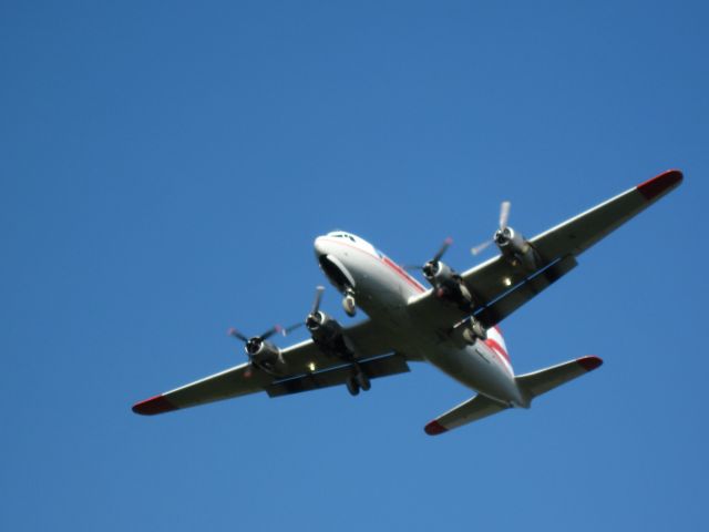 Douglas DC-6 — - On final. The pilot of this a/c never comes in on a long, straight final. So this a/c is hard to get a good shot of from my house because when I hear him. I have seconds to shoot.