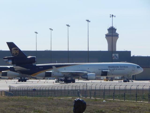 Boeing MD-11 (N275UP) - UPS768 being unloaded on the cargo ramp at DFW