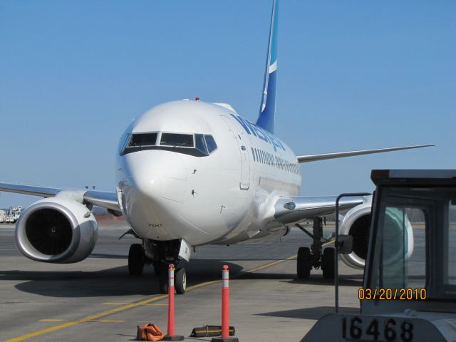 Boeing 737-700 (C-FWAQ) - Taxing to the arrival gate at Halifax International Airport  March 20 /2010