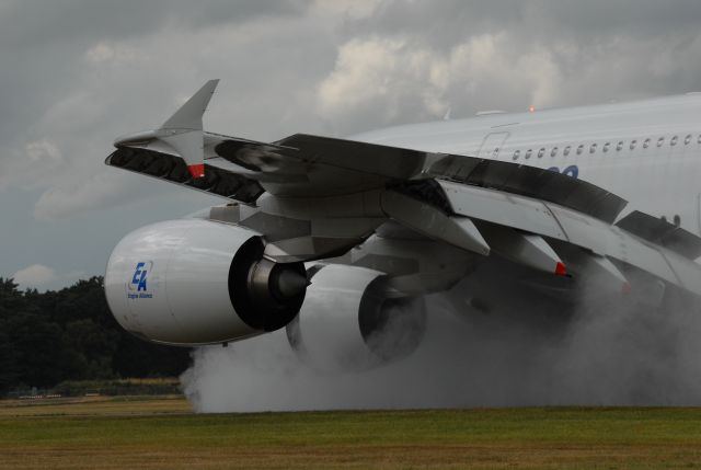 — — - Farnborough Airshow 2010 - the then new Airbus A380 touches down with full reverse thrust in traditional UK airshow weather. 