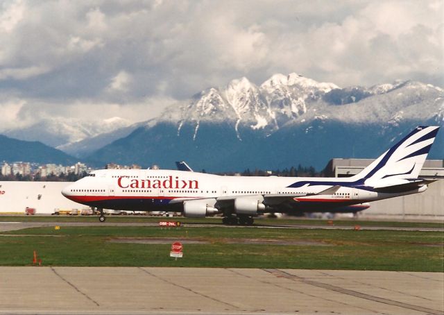 Boeing 747-400 (C-GMWW) - April 1999 photo I took at CYVR - fresh overnight snow highlights the Coast Range Mountains- this was the only jet I got in this color scheme.