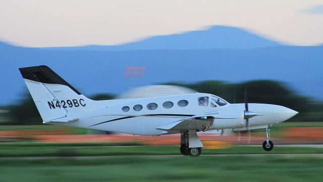 Cessna 421 (N429BC) - Departing at dusk, June 2015. 1/60 second exposure.