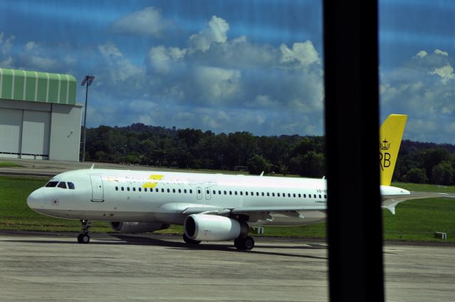 Airbus A320 (V8-RBV) - Behind Brunei Airport windows