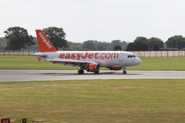 Airbus A319 (G-EZAA) - Operating flight U22052 from Geneva to Luton on the morning of 11th August 2019. Photo taken from top of multi storey car park. 