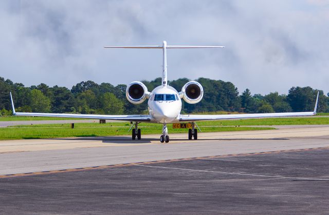 Gulfstream Aerospace Gulfstream IV (N176MG) - On a beautiful afternoon at Atlanta's PDK airport, I was getting some great shots as the lighting was excellent. This GIV had just landed and was taxiing to the ramp when I got this shot in near perfect symmetry. I was using a Canon 70-200 F 2.8 lens with the focal length at 137mm. Shutter was at 1/1300, F 4.0, ISO 100. Please check out me other aviation photography. Votes and positive comments are always appreciated. Questions about this photo can be sent to Info@FlewShots.com