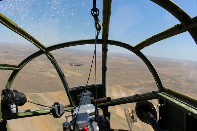 — — - B-25 "Tondelayo" has B-24 "Witchcraft" in its sights.....