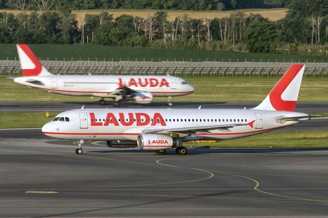 Airbus A320 (9H-IHD) - 12th June., 2022: Lauda Europe is a Maltese low-cost airline operating on behalf of its parent company Ryanair. It is the successor to now defunct Austrian carrier Lauda Air. Seen here is one of their 29 Airbus A320s taxiing for departure to Bristol (flight LW7306) as sister-ship lands on rwy 29 at Vienna Airport.