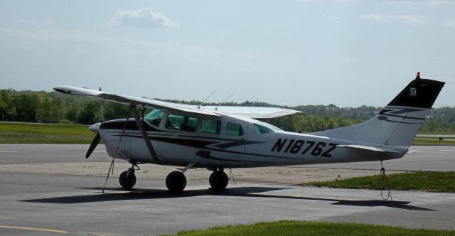 Cessna 205 (N1876Z) - Tied down is this 1962 Cessna 205 in the Spring of 2025.