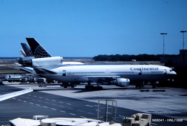 McDonnell Douglas DC-10 (N68041) - Honolulu,HI HNL/PHNL July 1998 photo of a Continental DC-10 at the gate in Honolulu, Hawaii. There is an American DC-10 behind the Continental and a Sun Country DC-10 in the background with the tail visible. This is LN 34.