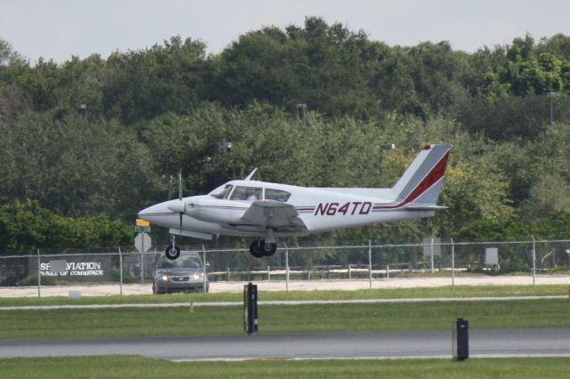 Piper PA-30 Twin Comanche (N64TD) - Piper Twin Comanche (N64TD) arrives at Sarasota-Bradenton International Airport