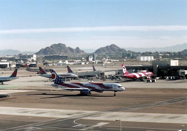 Boeing 757-200 (N905AW) - KPHX - 3 Logojets in this photo, as City of Columbus' taxis to the main runways - southside.