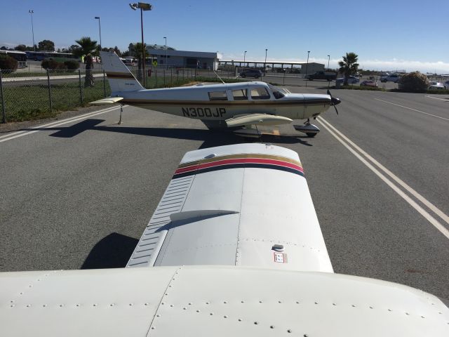 Piper Saratoga (N300JP) - Looking at a nice PA-32-300 while standing on the wing of my PA-32-300! Also, it appears this plane has the same STOL kit as my Six (Robertson R/STOL)