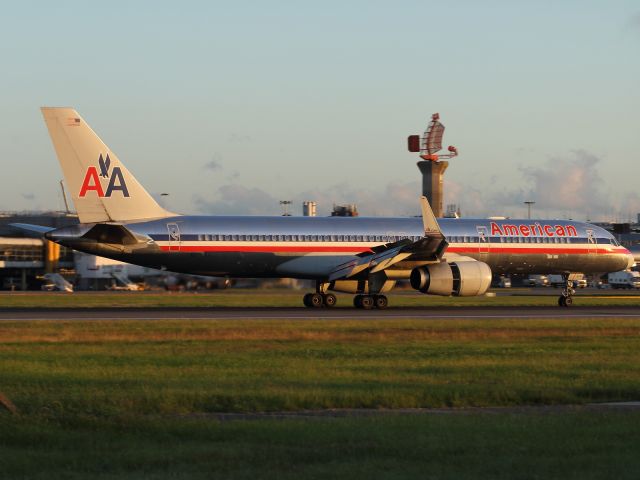 Boeing 757-200 — - Thrust reversers and spoilers fully deployed, as this American Airlines B757-200 lands on runway 027R at LHR.