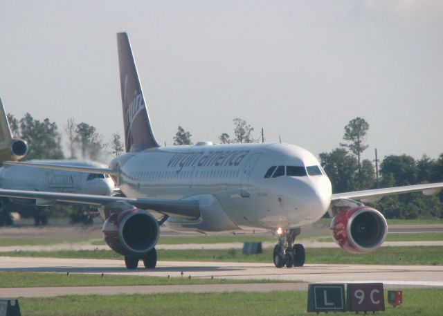 Airbus A319 (N528VA) - Taxiing in after landing at Orlando Sanford.