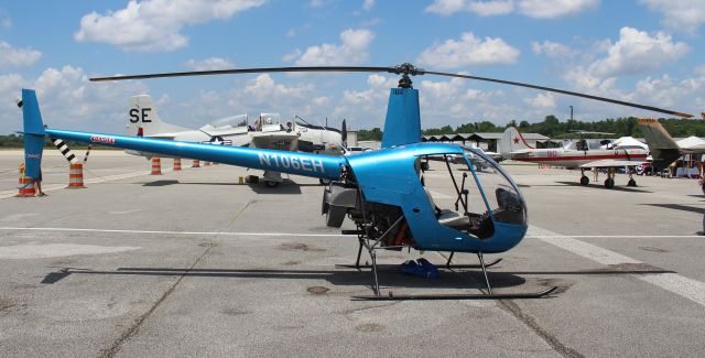 Robinson R-22 (N106EH) - A Robinson R-22 Beta on the ramp at Tom Sharp, Jr., Field, Huntsville Executive Airport, Meridianville, AL during the annual Save Our Flying Heritage Day - June 2, 2018. And before anybody complains, yes I know the types of aircraft in the background, but the R-22 is the focus of this particular image.