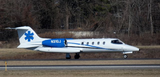 Learjet 35 (N31GJ) - Taxiing for departure is this Global Jetcare 1976 Learjet 36A in the Winter of 2025.  KPNE - SYCJ