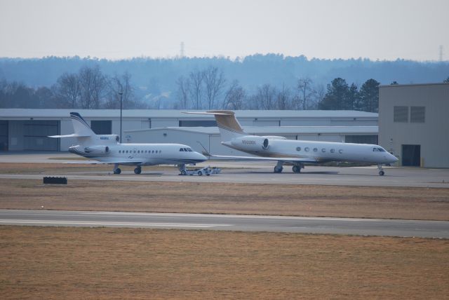 — — - N98NX parked next to N500RH in front of the Hendrick Motorsports hangar at Concord Regional Airport (Concord, NC) - 2/10/09