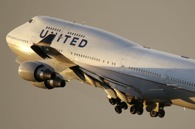 Boeing 747-200 — - Departing LHR.