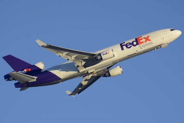 Boeing MD-11 (N582FE) - Fedex Express McDonnell-Douglas MD-11F N582FE departing for Memphis International Airport. Its construction number is 48419. It was manufactured in June 1990. It first flew registered as N511MD. It was delivered to American Airlines as N1751A on February 1, 1991. It was sold toe Federal Express as N582FE on January 22, 1886.