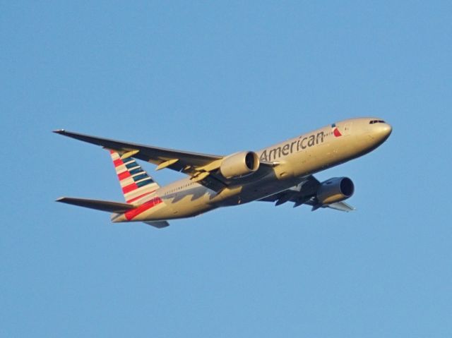 Boeing 777-200 (N767AJ) - Final to 18R with a nice sunset glow.