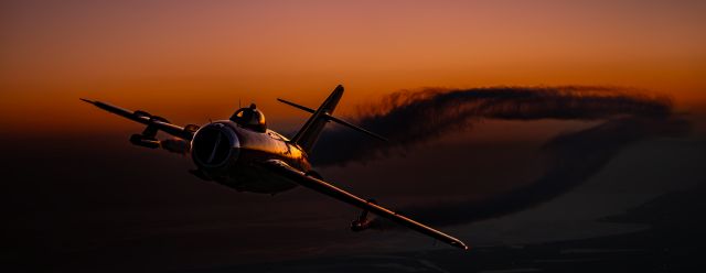 NX117BR — - Jason Somes in his MiG-17 cruising along the twilight horizon.br /br /This was an epic setup by Scott Slocum and another pleasure to photograph. We also did burner passes both with smoke on and smoke off. The greatest Thursday night of my life!br /br /Hope everyone enjoys.