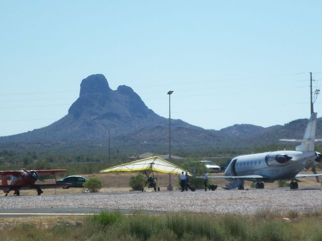 — — - at a fly-in. note Vulture Peak in the background.