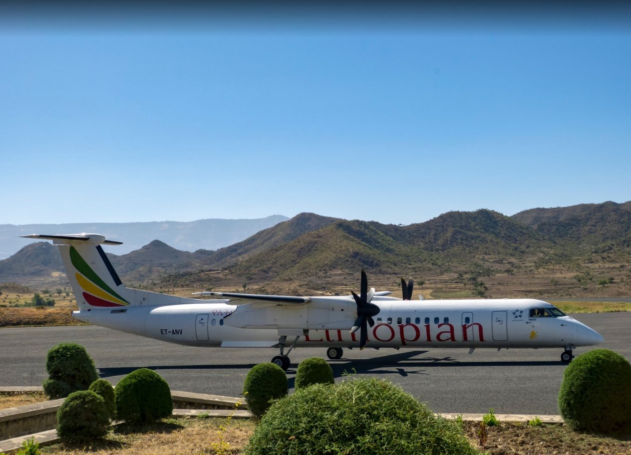 de Havilland Dash 8-400 (ET-ANV) - I was the last person to enter the terminal because I was too busy trying to capture the perfect shot of this ET Q400