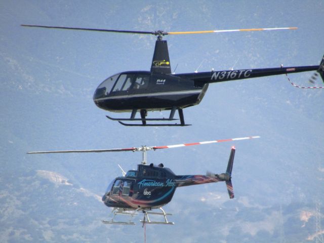 Bell JetRanger (N913RL) - Bell 206 Jet Ranger in "American Idol" livery, shooting an ad in tandem with a Robinson R44 at Brackett Field