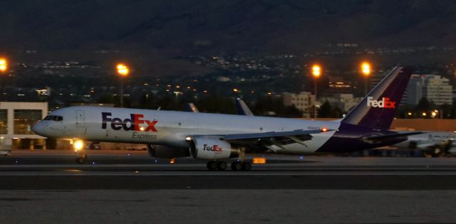 Boeing 757-200 (N962FD) - Just enough early dawn light at 5:20 AM for my lens to reach across from the east perimeter and catch FDXs "Nina" (N962FD) with the mains down on runway 16R as this B752 completes a short trip from KLAS.