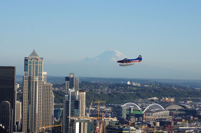 — — - DeHavilland DHC-3 Otter in front of Mt. Ranier, WA - approaching Lake Union, Seattle, WA