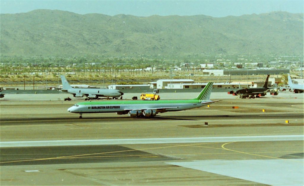 McDonnell Douglas DC-8-70 (N821BX) - KPHX - Burlington Air Express DC-8 rolling out on the south complex runway in July 1995 - i was down in Phoenix for the Airliners Intl Airline Collectible Show - awaiting friends from SJC to pick them up. The Arizona ANG base had 5 KC-135s this day and I can KMSITA for not getting the tail numbers. Temps were about 100 degrees this AM..I dunno how the people who work the ramps in 115+ weather -sun-scorching heat do it........tip o the cap to ya!